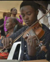 Davis playing at a function in the village
