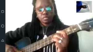 Amelia having a guitar lesson