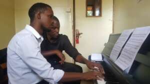 Jonathan with his teacher Mr. Luggya