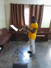 Ian practicing his Grade 4 Repertoire