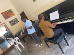 Ian in class with his teacher