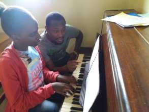 Kristen having a piano lesson