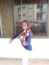 Phiona practicing her violin playing
