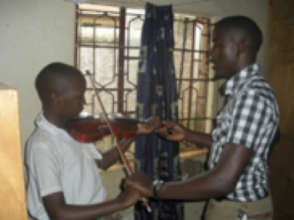 Sam teaching a student at St Mary Kevin School