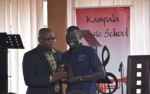 Ugen receiving his award