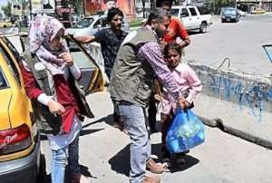 A girl on the street gets food