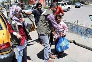 Taking food to kids on the streets in 50C/122F
