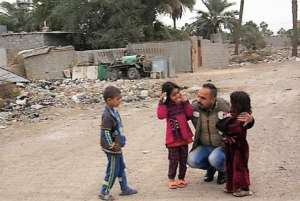 Street lawyer talks to kids in displaced area