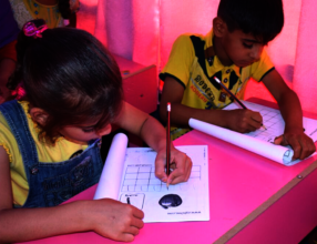 Learning to read and write at the Hope Buses