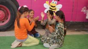 Playing outside the Hope Bus