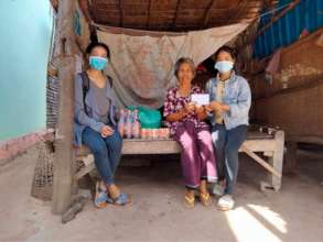 Jakkrya & Rina delivering food to poor families