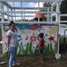Volunteers painting the ramp