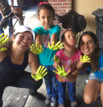 Salma painting Bola with the crew