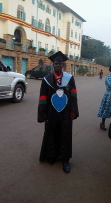 Joseph on graduation gown