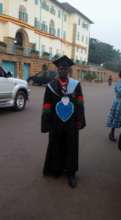 Joseph on graduation gown