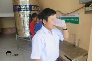 A sponsored child was drinking water.