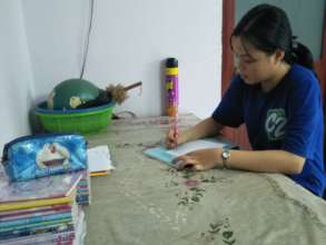 Trinh was writing letter to her sponsor.
