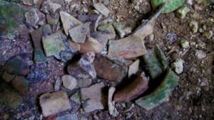 Broken pieces of pottery from a looted site