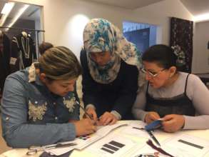 Learning embroidery at the Hope Workshop