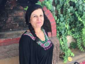 Huda is one of four Workshop embroidery trainers