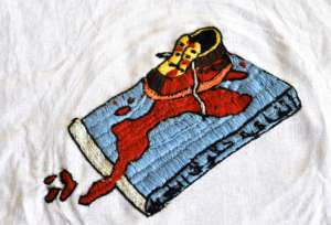 Child's Shoe on Human Rights Book