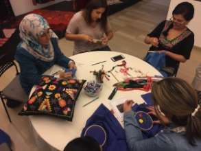 Making embroidery at the Hope Workshop