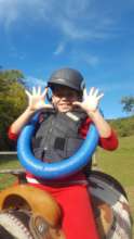 John playing a fun game during horse therapy
