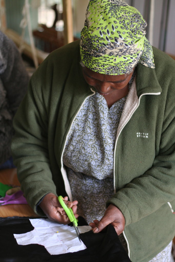 Karunga woman producing sanitary pad shield