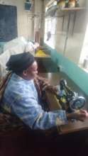 Karunga woman producing sanitary pad shield