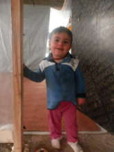 Young Yzidi boy at door of his shelter