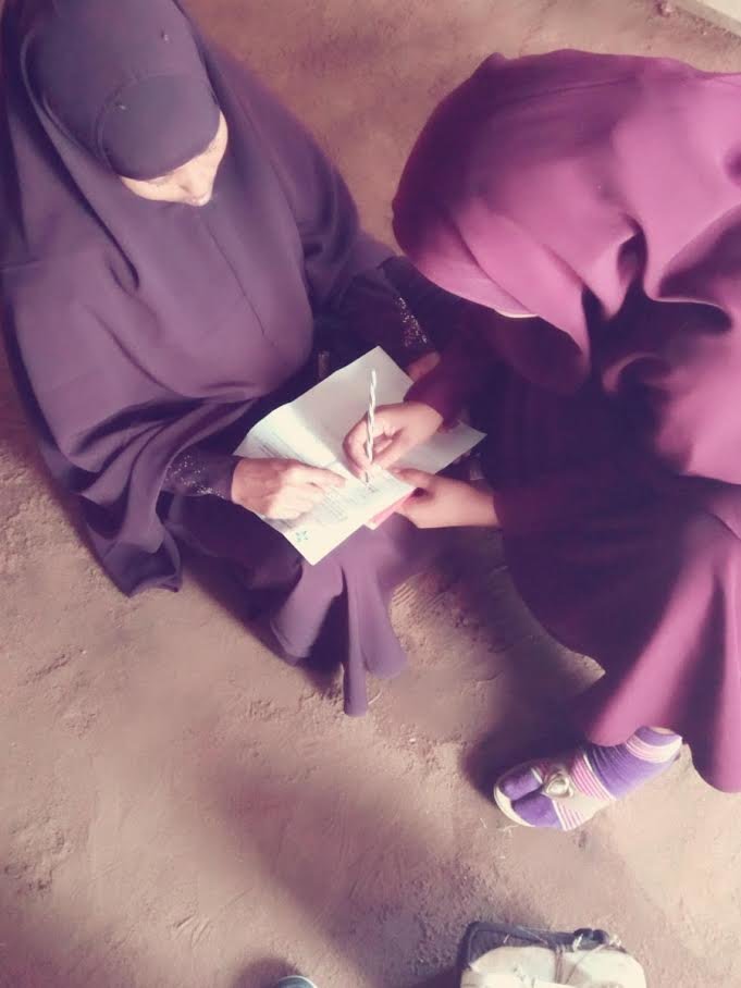 Two Somali women signing on to be a Peacebuilder!