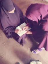 Two Somali women signing on to be a Peacebuilder!