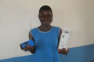 Girl smiling - holding her solar radio