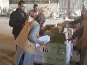 MECA staff and partners check inventory