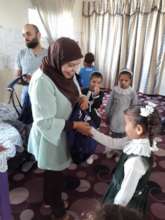 Our partner center in Rafah distributing backpacks