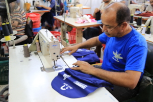 Making the backpacks at Gaza factory