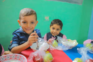A few of the children who receive nutritious meals