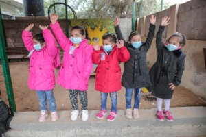 Girls in Gaza with their new winter jackets