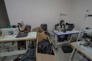 Sewing backpacks in Gaza factory