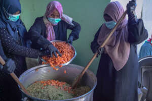 Preparing hot meals for displaced families