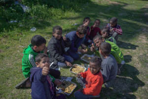 Children enjoying their meal after a day of games