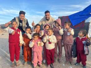 Distributing warm clothes to children in Gaza