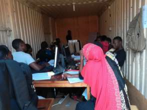 IT instructor orients new students in comupter lab