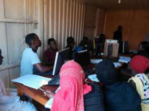 Still IT instructor with his students in the lab