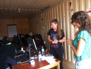 Donata and Fausta teaching how to use internet