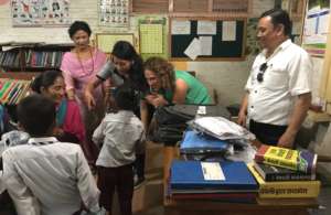 Distributing uniforms at Dattatraya School