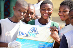 iLEAD students in action;handing out mosquito nets