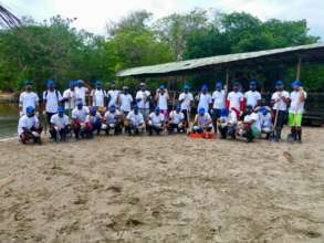 The Mundo Verde team comes out to clean up