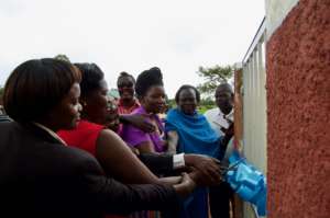 Government officials cutting the ribbon