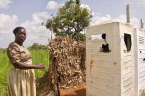 Auma, the Ogul head teacher, at the boys' toilet